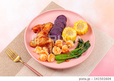 low Calorie Fitness Meal With Boiled Shrimps Hard Boiled Eggs Purple Sweet Potatoes And Greens 141501604