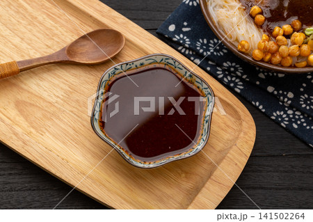 spicy Korean buldak sauce, hot chili oil paste for fire chicken noodles, fiery intense Asian culinary condiment. spicy Korean buldak sauce, hot chili oil paste for fire chicken noodles, fiery intense Asian culinary condiment. 141502264