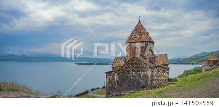 Ancient Sevanavank monastery against Lake Sevan in Armenia with copy space 141502589