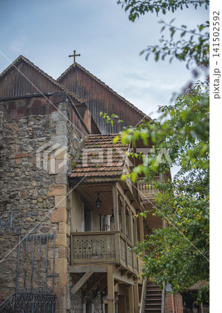 Traditional carved wooden balconies of an ancient monastery in Armenia with copy space Traditional carved wooden balconies of an ancient monastery in Armenia with copy space 141502592