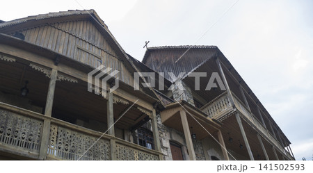 Ancient carved wooden balconies of a traditional building in Armenia with copy space Ancient carved wooden balconies of a traditional building in Armenia with copy space 141502593