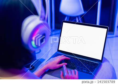 Hands using laptop with blank screen, computer mockup and digital technology concept. 141503789
