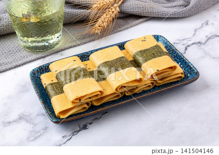 crispy egg roll pastry wrapped with seaweed nori crispy egg roll pastry wrapped with seaweed nori 141504146