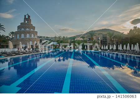 Bodrum, Turkey -June 4 2026: Selectum collection Bodrum is a 5 star all inclusive resort located in Akyarlar Turkey . Picture showing the prominent tower structure at the main pool area, Daylight shot Bodrum, Turkey -June 4 2026: Selectum collection Bodrum is a 5 star all inclusive resort located in Akyarlar Turkey . Picture showing the prominent tower structure at the main pool area, Daylight shot 141506063