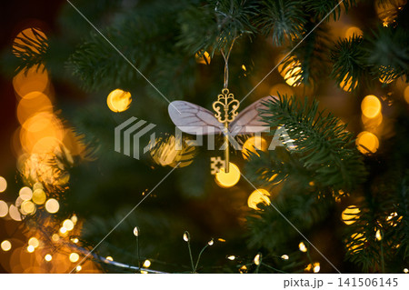 Winged Key Christmas Ornament on Pine Branches Winged Key Christmas Ornament on Pine Branches 141506145