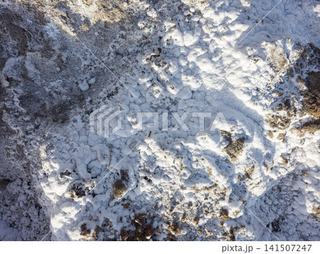 View of white mineral salt crust and saline soil texture in Salinas de Santa Pola during dry season View of white mineral salt crust and saline soil texture in Salinas de Santa Pola during dry season 141507247