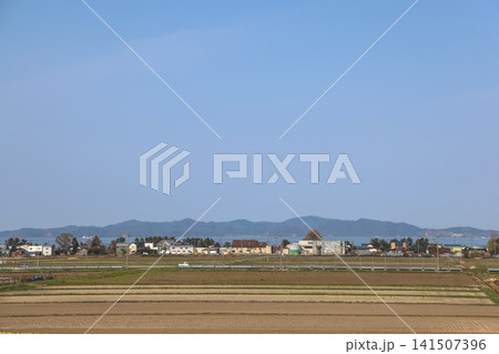 April 26 2026 Shin Aomori rural fields with coastal town, Japan 141507396