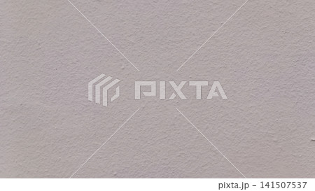 Close up high angle view of a uniformly lit gray concrete wall with fine bumps, roughness, and subtle surface variation a clean, neutral background texture. 141507537