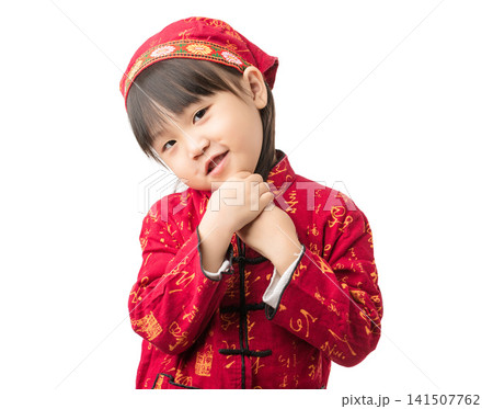 A portrait of an Asian girl in ethnic minority clothing standing against a white background. A portrait of an Asian girl in ethnic minority clothing standing against a white background. 141507762