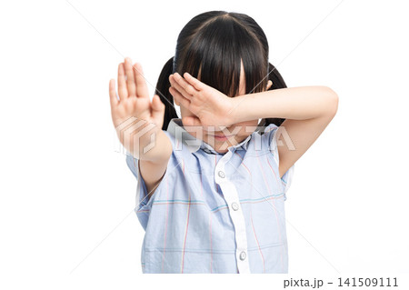 Little girl gesturing stop and covering eyes in fear, child protection and emotion concept Little girl gesturing stop and covering eyes in fear, child protection and emotion concept 141509111