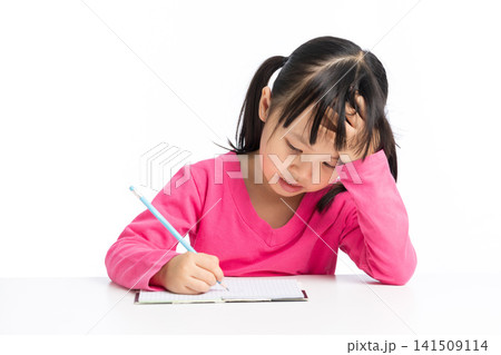 Tired student girl having headache while doing difficult homework Tired student girl having headache while doing difficult homework 141509114