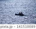 2 people on a small boat 141510089