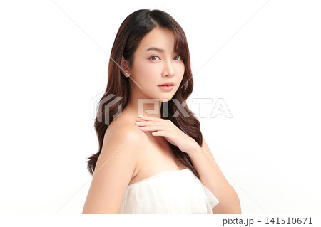A beautiful young Asian woman with clean, fresh skin against a white background. Skincare, facial treatment, cosmetology, beauty, and spa. An elegant portrait of an Asian woman. A beautiful young Asian woman with clean, fresh skin against a white background. Skincare, facial treatment, cosmetology, beauty, and spa. An elegant portrait of an Asian woman. 141510671