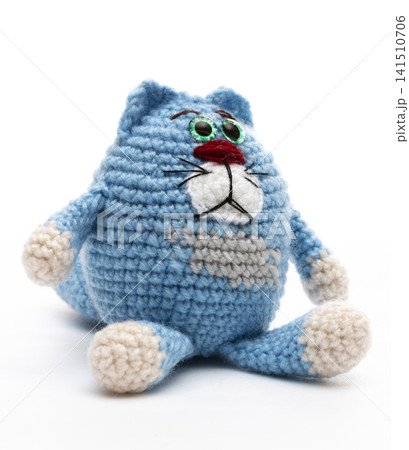 Knitted cat on a white background Knitted cat on a white background 141510706