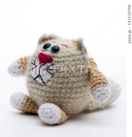 Knitted cat on a white background Knitted cat on a white background 141510709