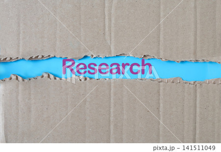 Word RESEARCH is written on tear paper. Word RESEARCH is written on tear paper. 141511049