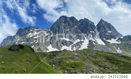 Chaukhi peaks dominate Georgia's Caucasus highlands, combining sheer rock walls, snow gullies and alpine terrain Chaukhi peaks dominate Georgia's Caucasus highlands, combining sheer rock walls, snow gullies and alpine terrain 141511088