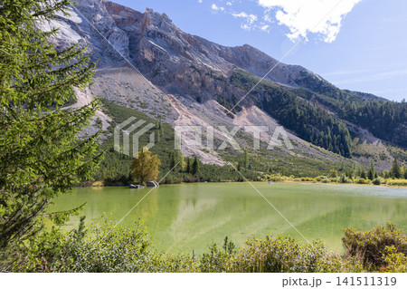 Le Piciodel lake on the Fanes plateau below the limestone wall of Col Bechei Le Piciodel lake on the Fanes plateau below the limestone wall of Col Bechei 141511319