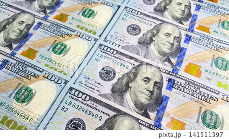 The background of money from the American national currency. US$ 100 bills. Economics, business and finance. Background of cash hundred dollar bills. The background of money from the American national The background of money from the American national currency. US$ 100 bills. Economics, business and finance. Background of cash hundred dollar bills. The background of money from the American national 141511397