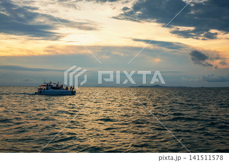 Sihouette foreign tourists in private yacht to view sunset, Pattaya 141511578