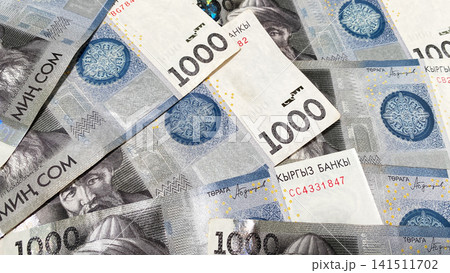 Banknotes in 1000 som. Background of Kyrgyz money. Kyrgyz national currency. Business, economics and finance. Banknotes in 1000 som. Background of Kyrgyz money. Kyrgyz national currency. Business, economics and finance. 141511702