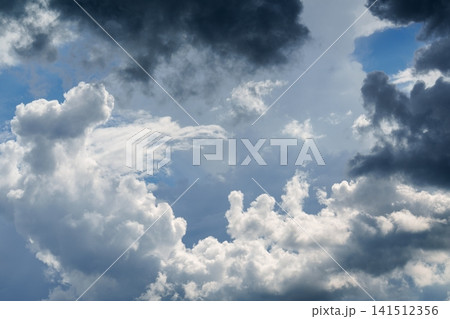Dramatic Storm Clouds with Sunlight Breaking Through Before Rain.  Weather. 141512356