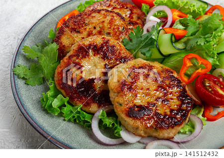 fried chicken cutlets, minced chicken, with vegetables, on gray , with vegetable salad, top view, homemade, no people, 141512432