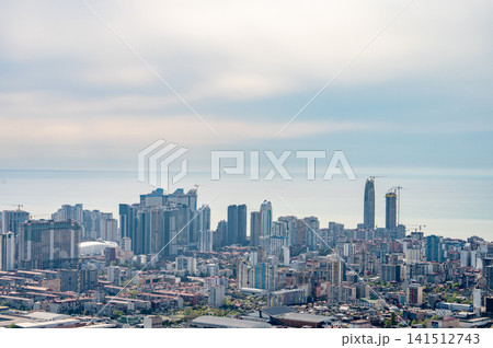 Panoramic urban skyline with coastal horizon seen from hilltop point. Panoramic urban skyline with coastal horizon seen from hilltop point. 141512743