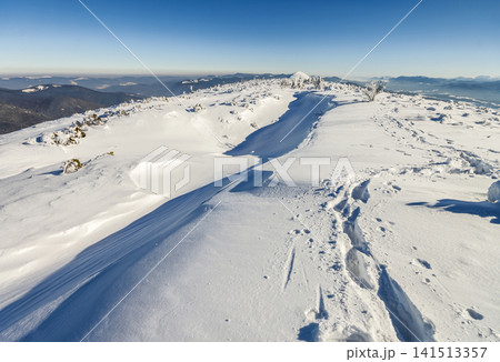 Snow covered mountains in sunny day. Colorful outdoor scene, Happy New Year celebration concept. Snow covered mountains in sunny day. Colorful outdoor scene, Happy New Year celebration concept. 141513357