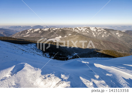 Snow covered hills in winter mountains. Arctic landscape. Colorful outdoor scene, Happy New Year celebration concept. Snow covered hills in winter mountains. Arctic landscape. Colorful outdoor scene, Happy New Year celebration concept. 141513358