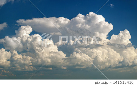Rain clouds forming on blue Florida sky. Colorful summer skyscape 141513410
