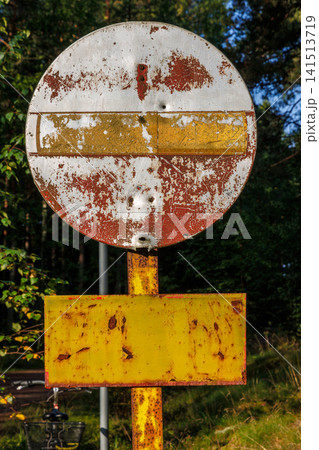 Weathered no entry sign on forest road near Hamina, Finland. Weathered no entry sign on forest road near Hamina, Finland. 141513719