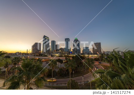 Tampa, Florida. Downtown district of American city after sunset with brightly illuminated high buildings and highway traffic. USA travel destination. 141517274