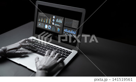Futuristic robotic hand interacting with laptop displaying data analytics and graphical dashboards in a dark environment for high-tech themes. Gantry 141519561
