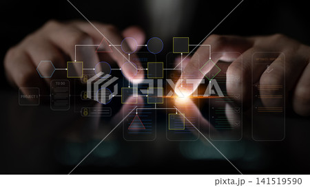 Hands interacting with touchscreen devices while working on project management visuals and flowcharts for planning and organization in a modern workspace Fluxor Hands interacting with touchscreen devices while working on project management visuals and flowcharts for planning and organization in a modern workspace Fluxor 141519590