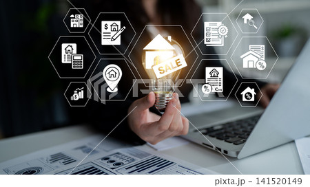 Business Professional Displaying Light Bulb with Sale Tag Surrounded by Real Estate Icons and Data Charts in Modern Office Setting. Glyphic 141520149