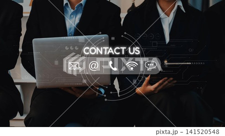 Professional Business Team Engaged in Communication with Laptops and Contact Icons, Showcasing Modern Technology and Connection Strategies. Raster 141520548