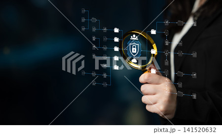 Hand Holding Magnifying Glass Highlighting Digital Security Icons with Protection Elements and Data Flow in a Tech-Focused Concept for Privacy and Analysis. Sentient 141520632