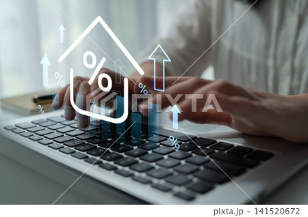 Hands typing on laptop keyboard with graphic icons of rising arrows and percentage signs representing growth in data analysis and financial investment trends. Gantry 141520672