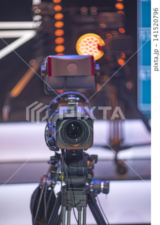 Professional broadcasting television camera on tripod in empty tv studio room with copy space Professional broadcasting television camera on tripod in empty tv studio room with copy space 141520796