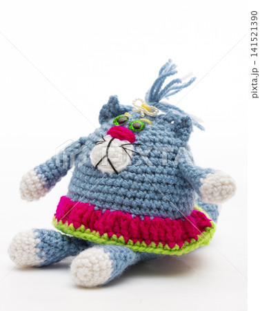 Knitted cat on a white background Knitted cat on a white background 141521390