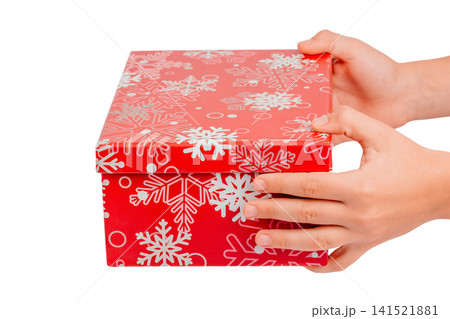 Hands Holding Red Christmas Gift Box Isolated on White Background Hands Holding Red Christmas Gift Box Isolated on White Background 141521881