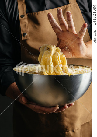 Baker Handling Sticky Bread Dough During Fermentation Process Baker Handling Sticky Bread Dough During Fermentation Process 141521984