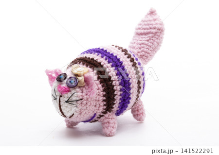 A crocheted cat toy on a white background A crocheted cat toy on a white background 141522291