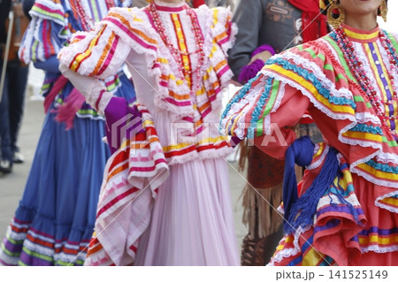 Mexican folk parade in the street Mexican folk parade in the street 141525149