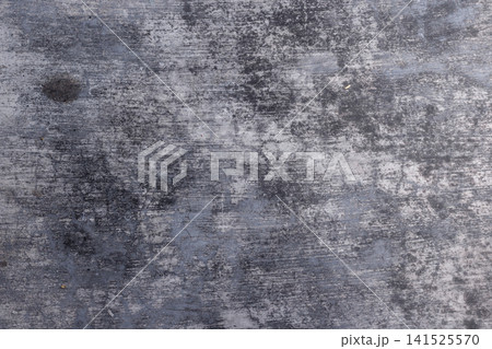 Flat lay texture of dark gray weathered concrete surface with fine scratches and mottled aged floor details. High Quality Photo 141525570