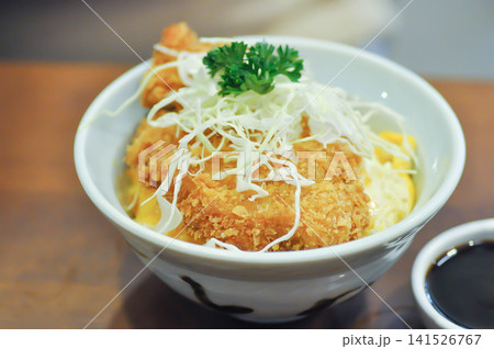 fried pork and rice, pork ball or Breaded Pork Cutlet Bowl or Butadon or Deep fried Pork Cutlet on Rice or Japanese pork cutlet or Tonkatsu 141526767