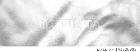 Soft white textured fabric with gentle folds and subtle metallic sheen background Soft white textured fabric with gentle folds and subtle metallic sheen background 141526908