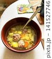 Bowl of Soup with Meatballs, Green Peas and other Vegetables. 141527746