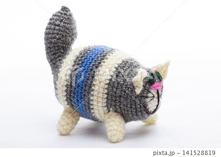 A crocheted cat toy on a white background A crocheted cat toy on a white background 141528819
